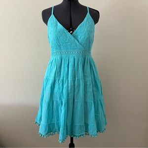 Turquoise teal short dress with Pom Pom hem and crochet detail on bust